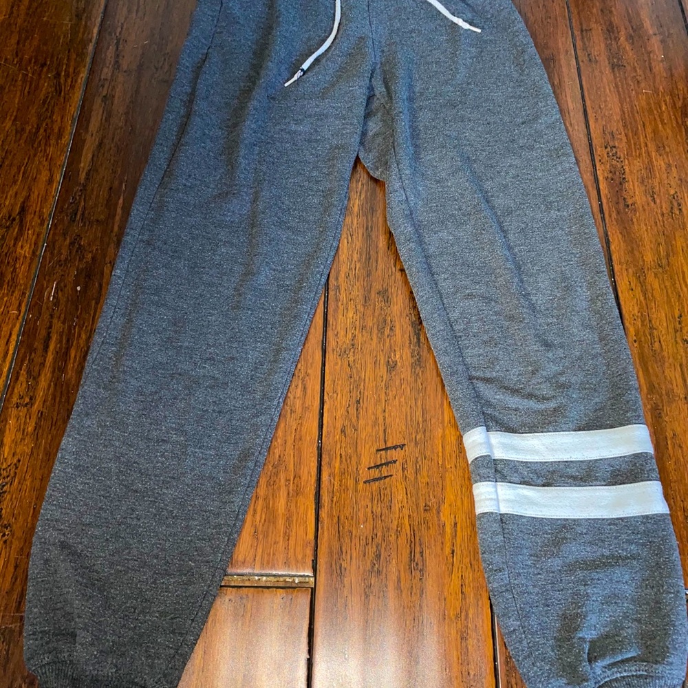 Grey sweatpants. Joggers cinched ankles. Sweats.